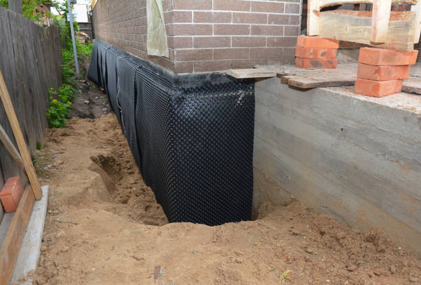 Happy homeowners after waterproofing job in South River